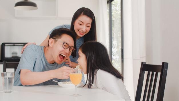 Asian japanese family has breakfast at home. asian happy dad, mom ...
