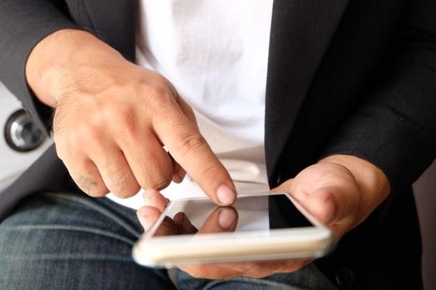 Asian man hands using smart phone, social media concept | Free Photo